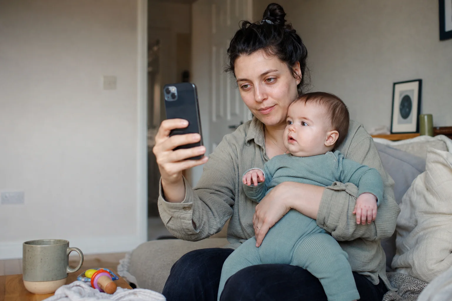 A parent recording an honest video with her baby